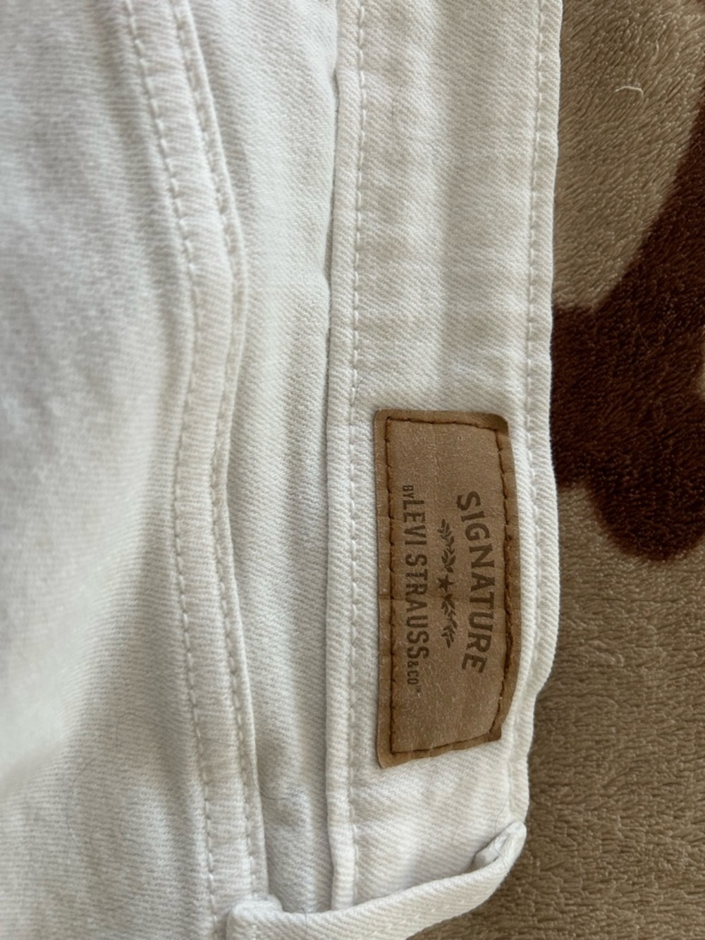 Levi Strauss signature white Jean shorts.  Lightly distressed.